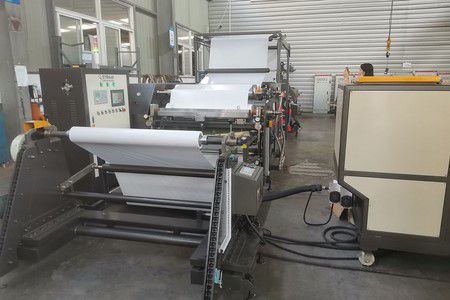 Système d'enduction d'adhésif thermofusible